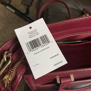 Kate Spade bag in the color black cherry
